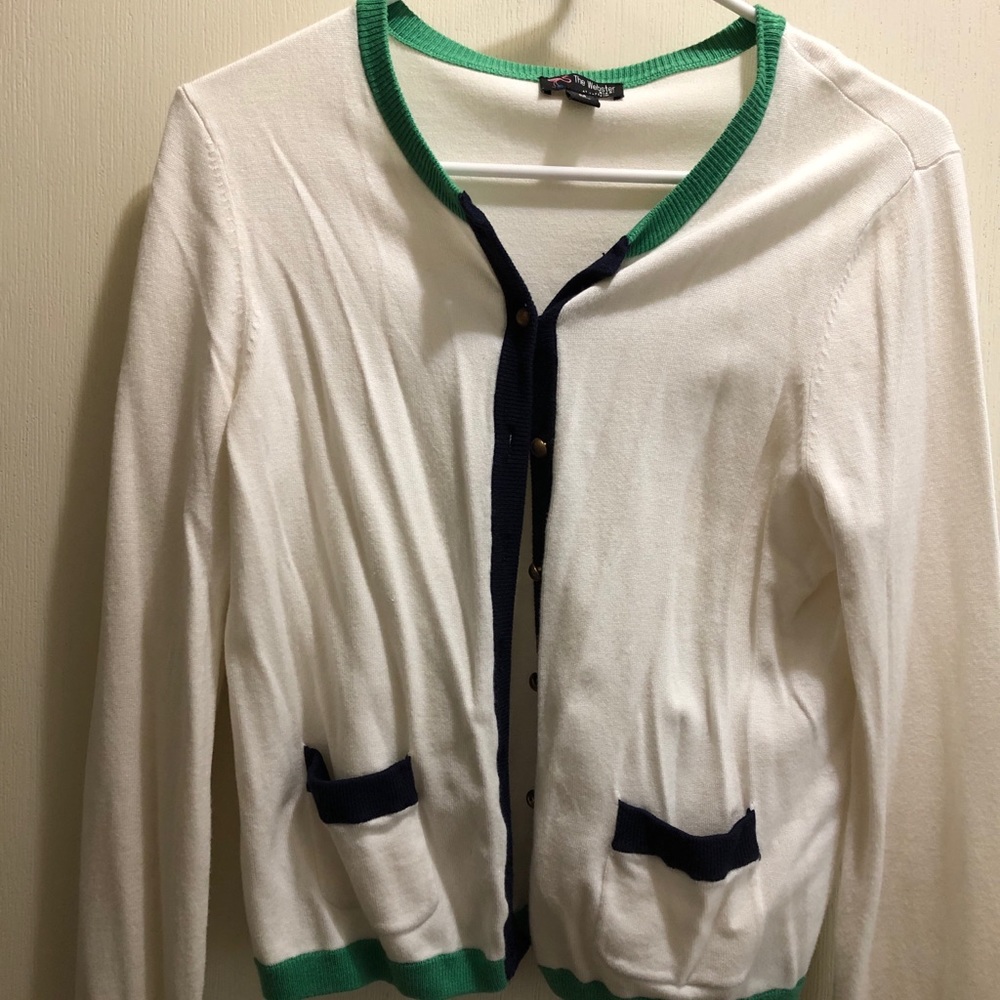 White cardigan with green and blue accents